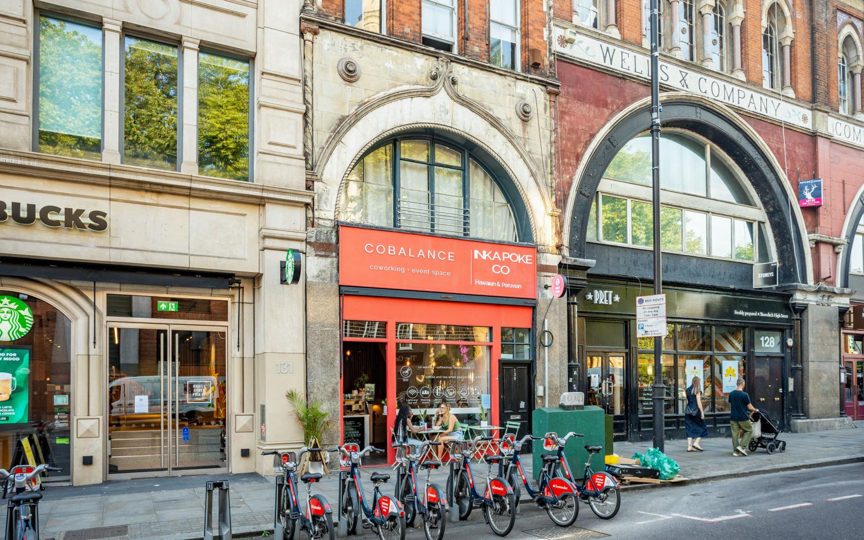 A versatile event space with an arched window facade and brick exterior at My Buzzspace.
