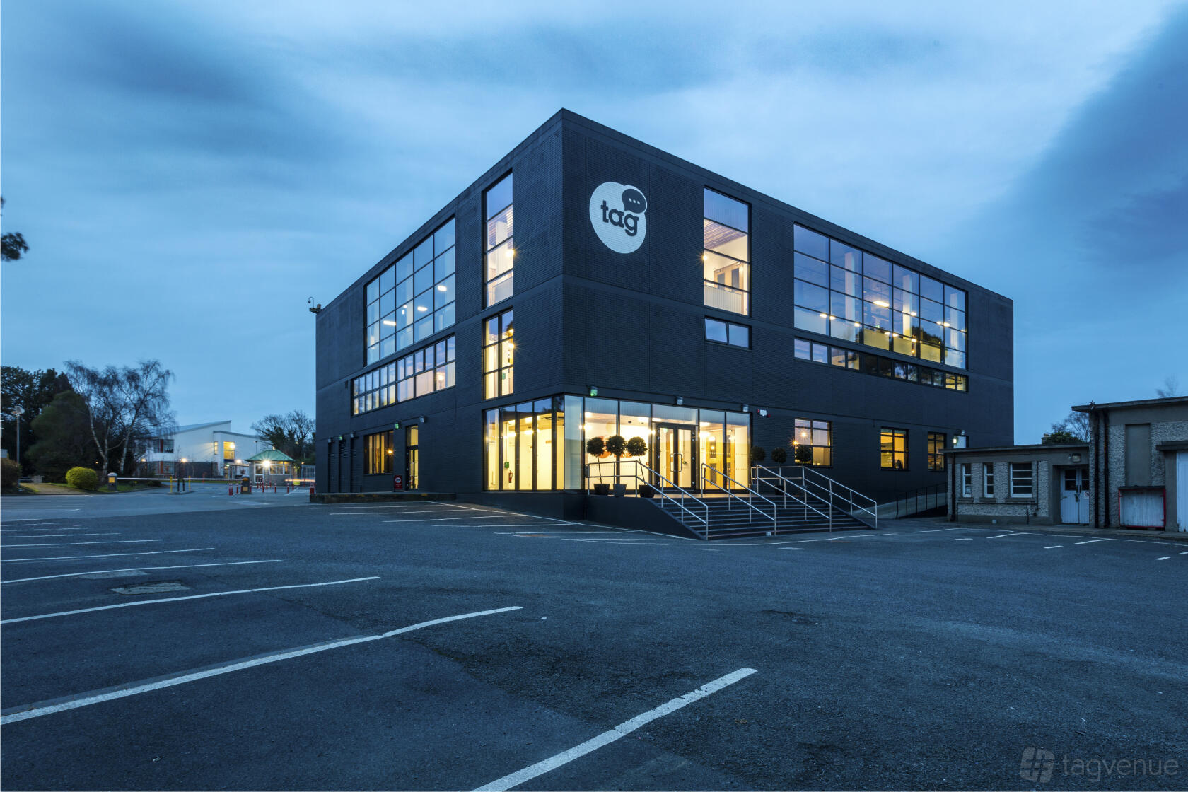 A standalone coworking space with large windows and an exterior staircase at Talent Garden Dublin.
