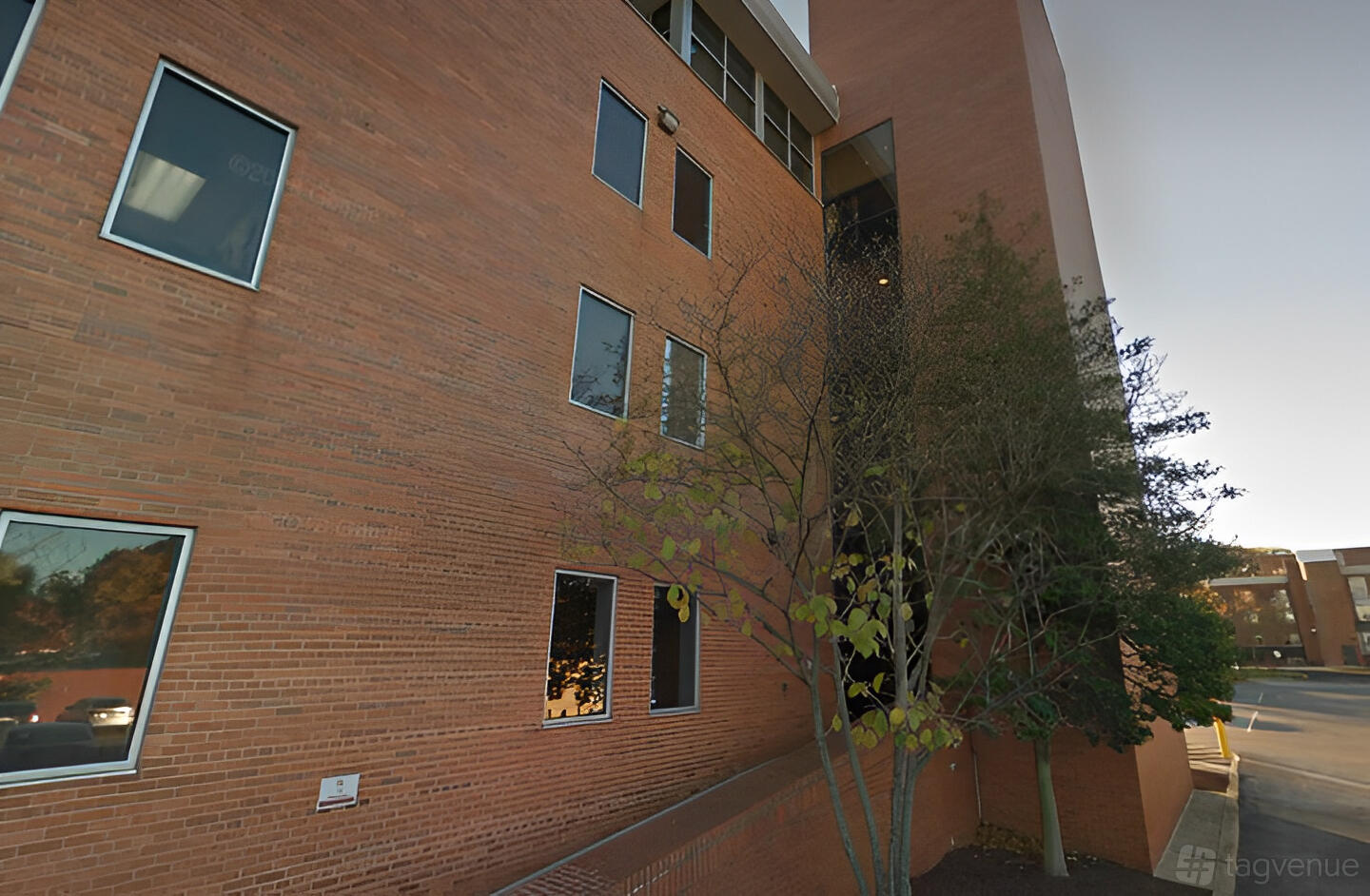 A meeting centre with a brick exterior facade and several windows at Perfect Office Solutions - Riverdale 6200.