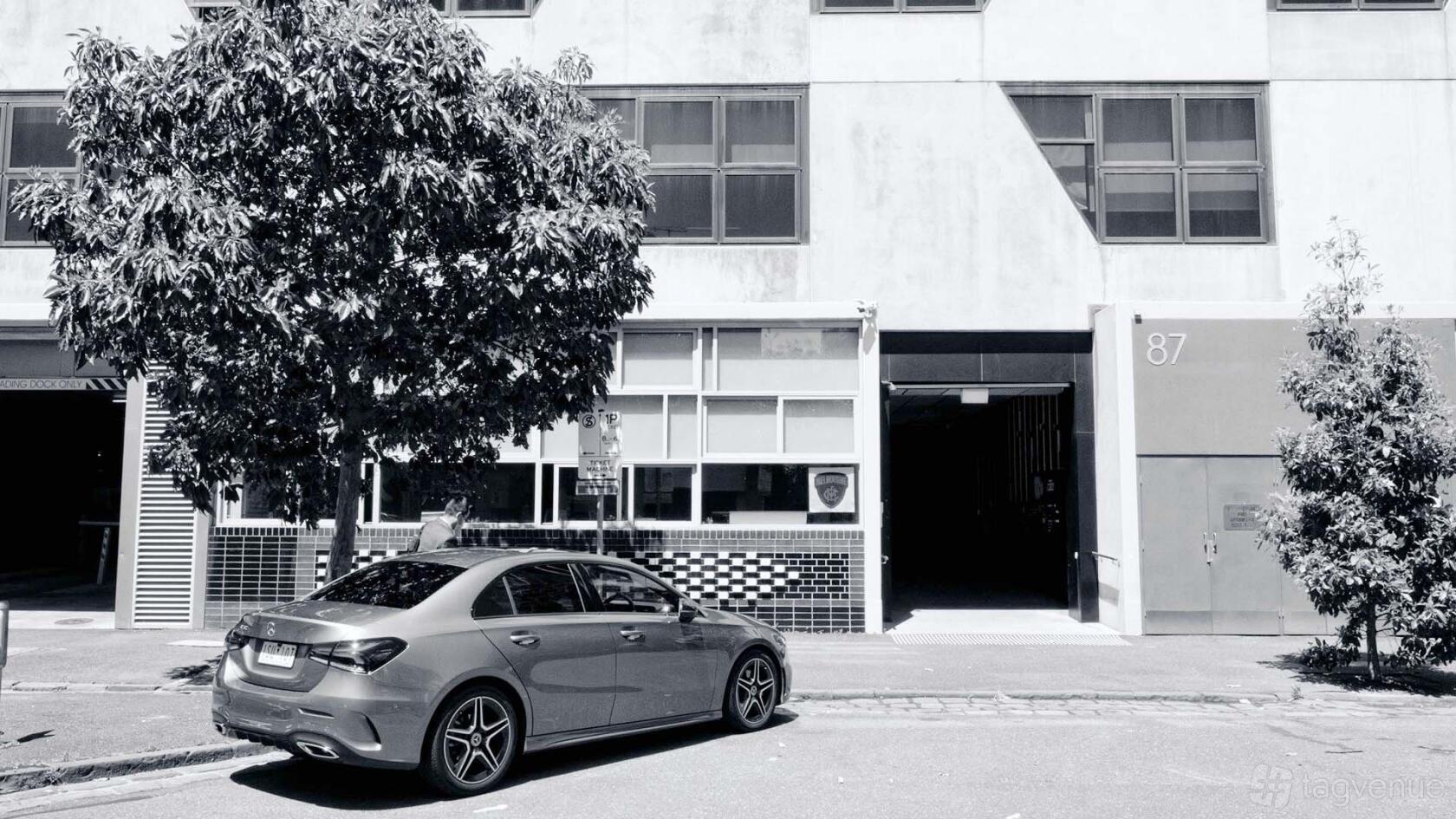 A film and photo studio with a wide garage-style entrance and tiled facade at POP! Photography Studio.