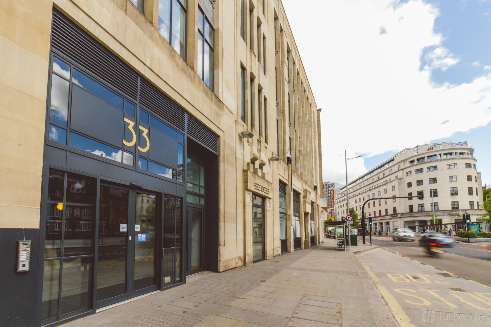 A meeting centre with a modern stone exterior, tall windows, and street entrance at Orega Bristol