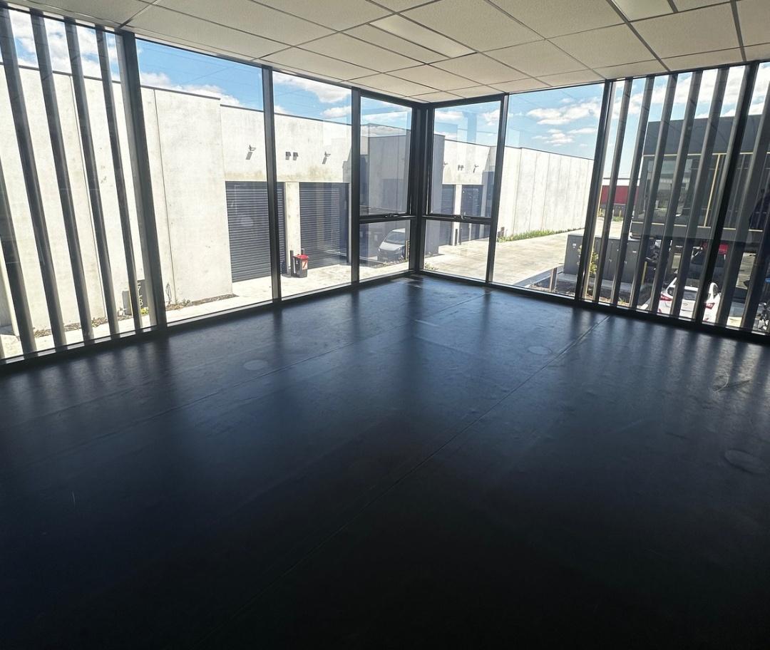 A dance studio event space with floor-to-ceiling windows and natural light at Beat Dance.