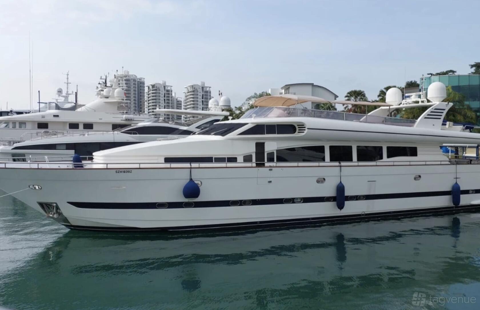 A boat venue with a modern white yacht, dockside setting, and visible upper deck at Sea Friends.