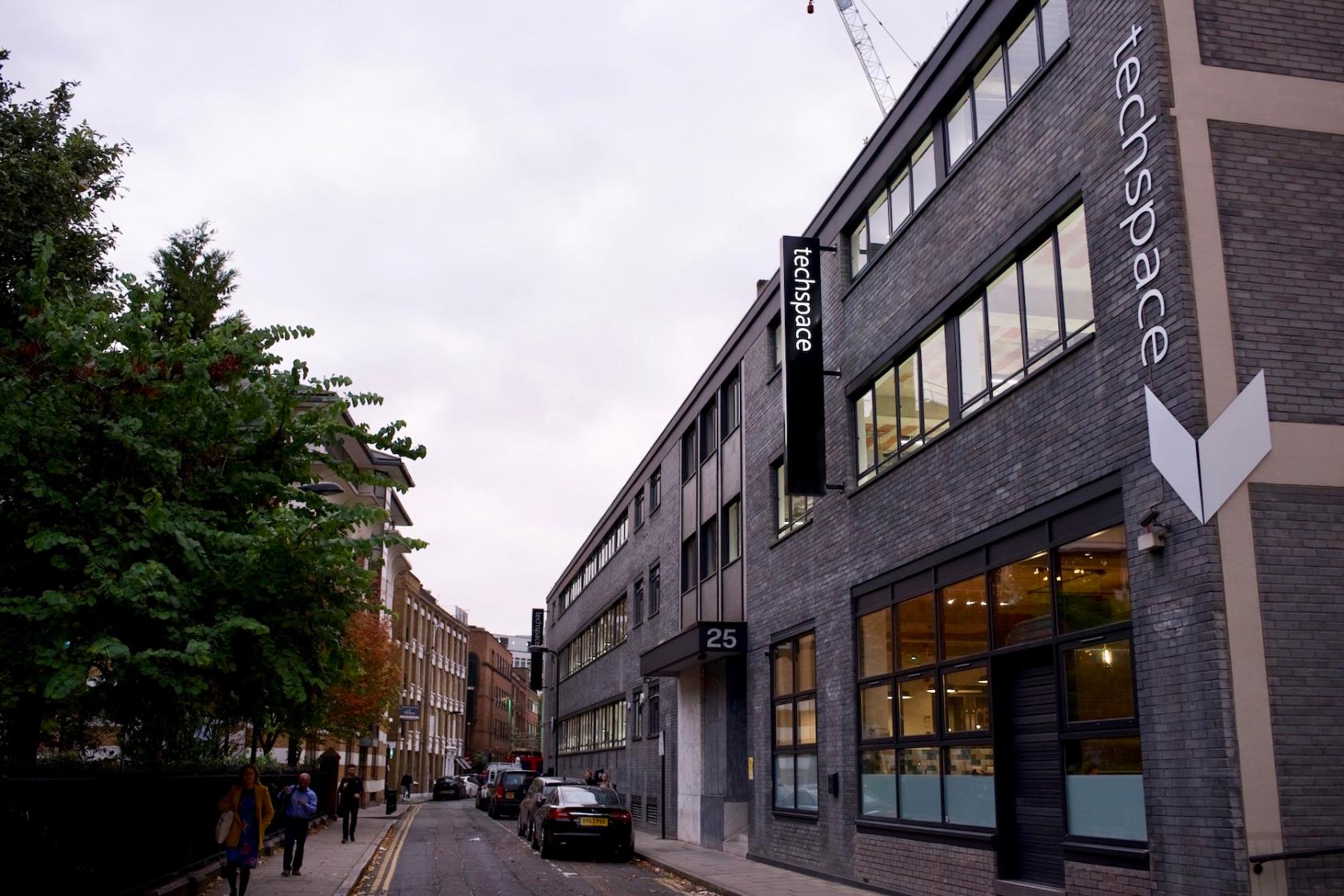 A grey brick versatile event space with large windows and prominent techspace signage at Techspace Shoreditch.