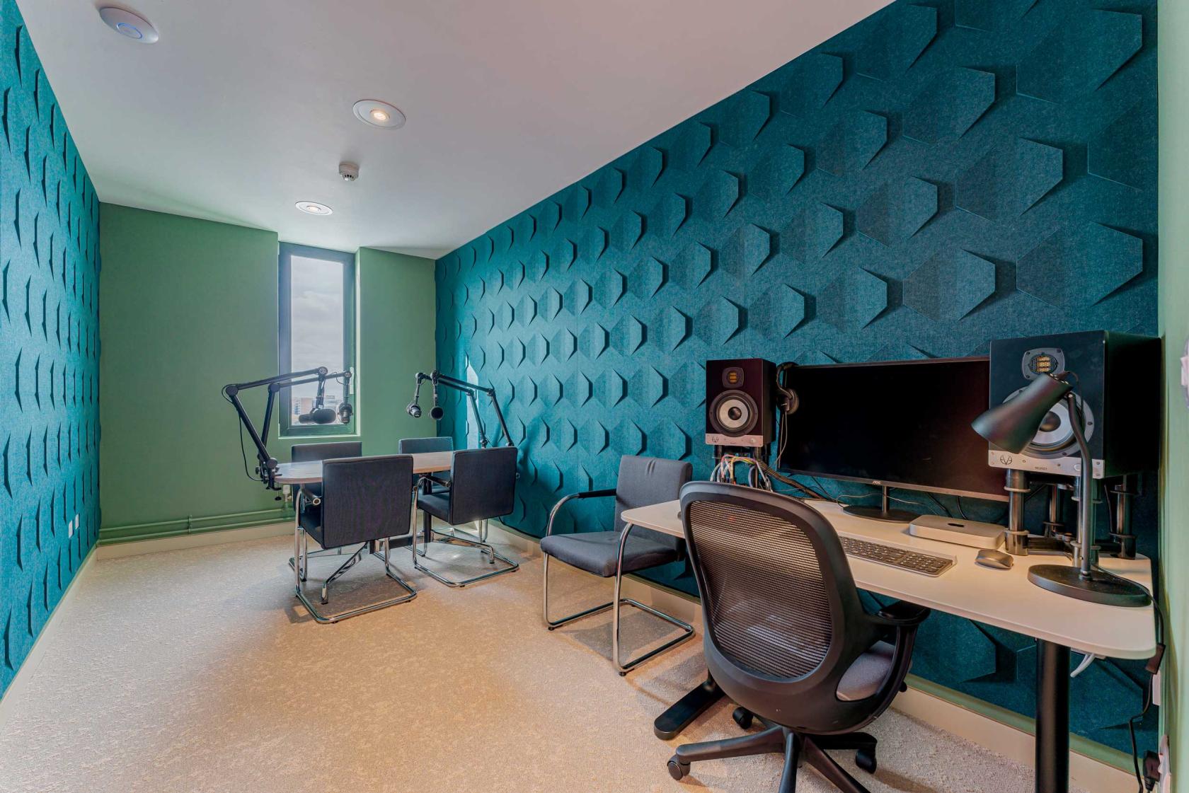 FACT Liverpool sound studio with table, microphones, acoustic panels and control desk