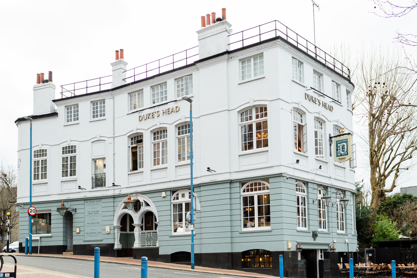 A traditional pub with white and grey exterior, large sash windows, and classic signage at Duke's Head Putney.