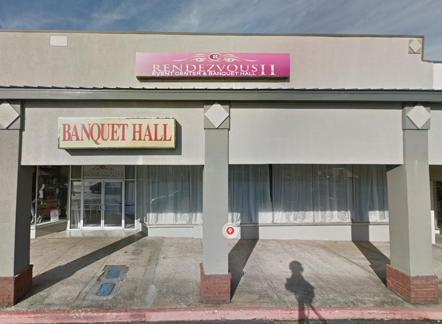 A versatile event space exterior with large glass windows and a marquee sign at Rendezvous Event Center.