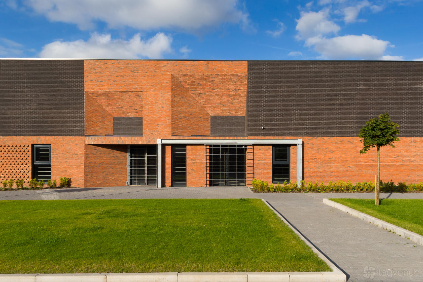 A film and photo studio with a brick facade, geometric patterns, and large entry doors at Foundry Film Studios.