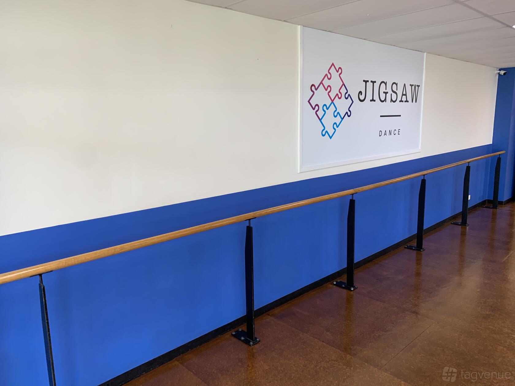 A dance studio with a long wooden barre and blue-and-white walls at Studio & Venue Hire Castle Hill.