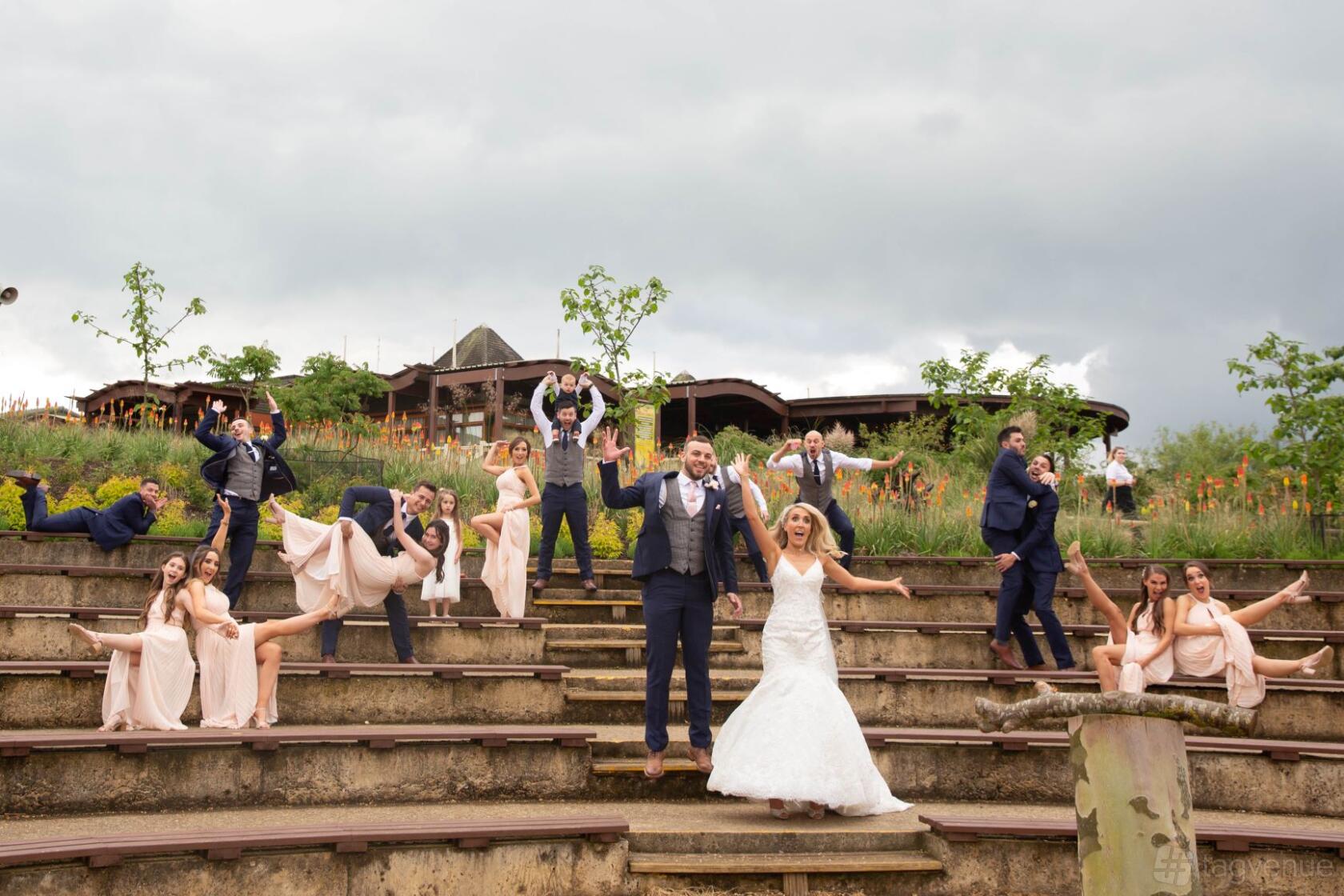 An outdoor amphitheatre with tiered stone seating surrounded by greenery at Woburn Safari Park.