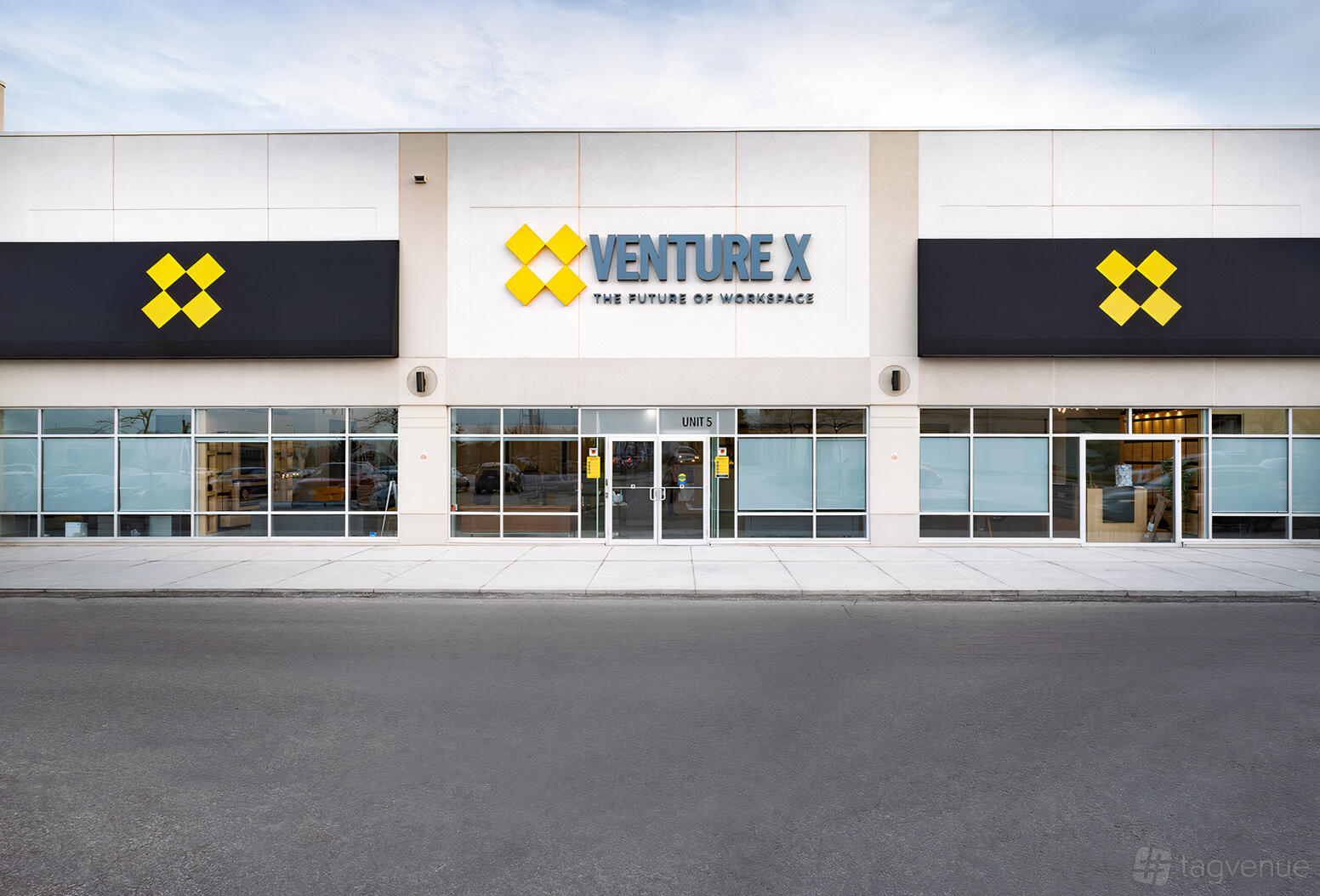 A meeting centre with large windows and bold signage at Venture X Heartland.
