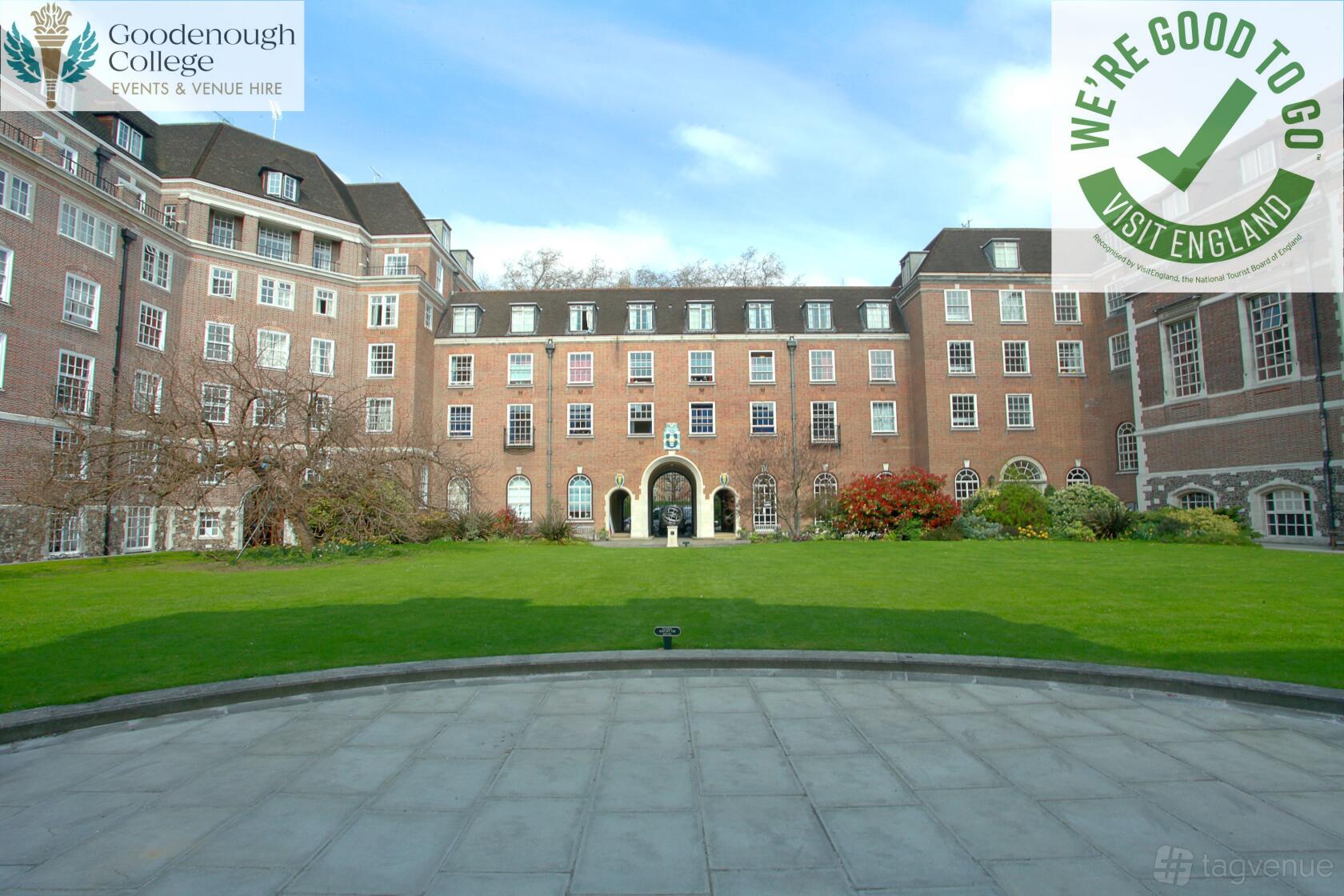 An academic venue with a large lawn courtyard surrounded by red brick buildings at Goodenough House.