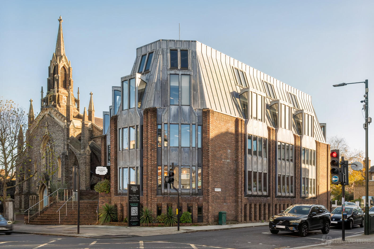 A meeting centre with large glass windows and a modern brick facade at Kew Road.