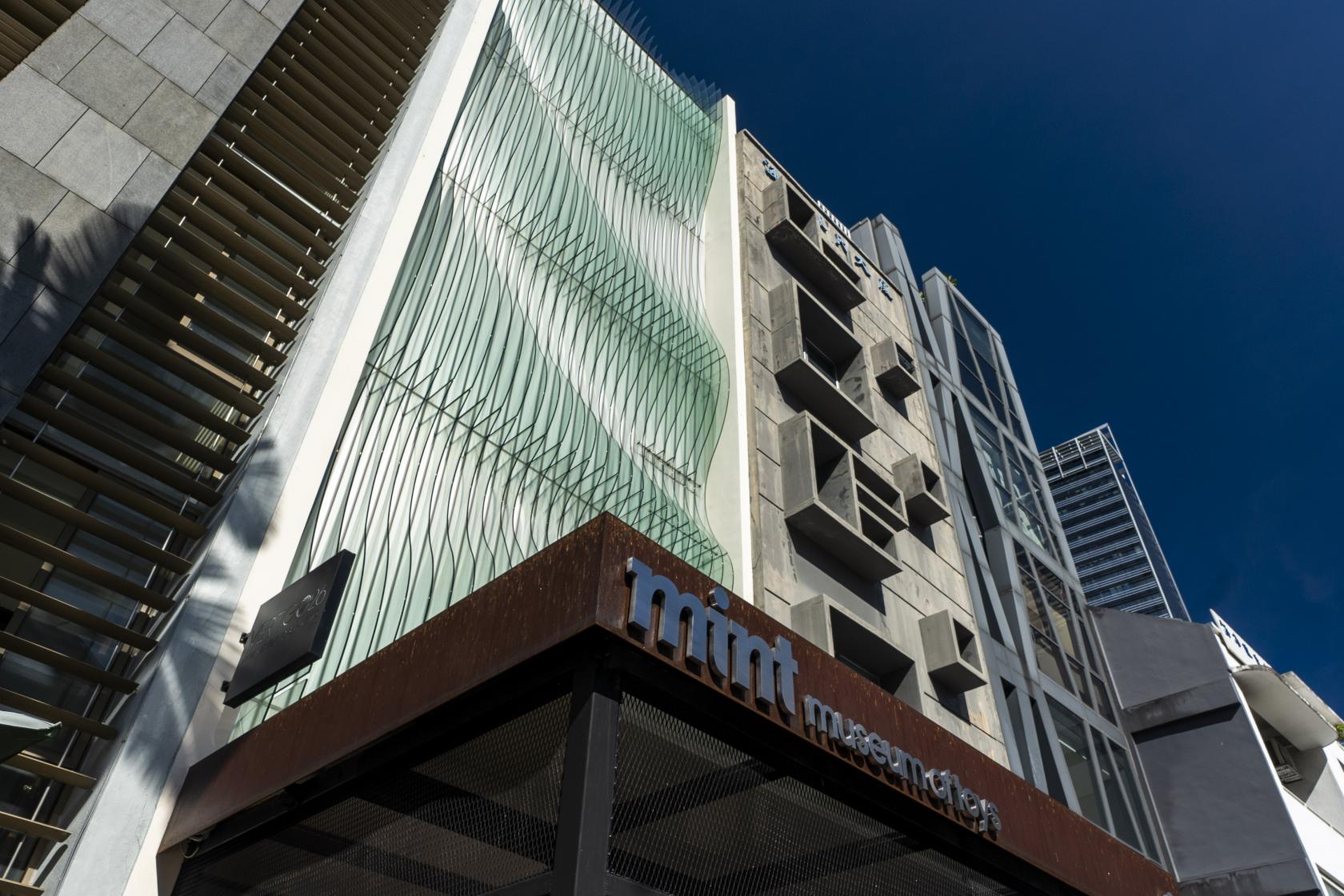 A rooftop event venue with a modern glass facade and vertical metal elements at The Public Gallery.