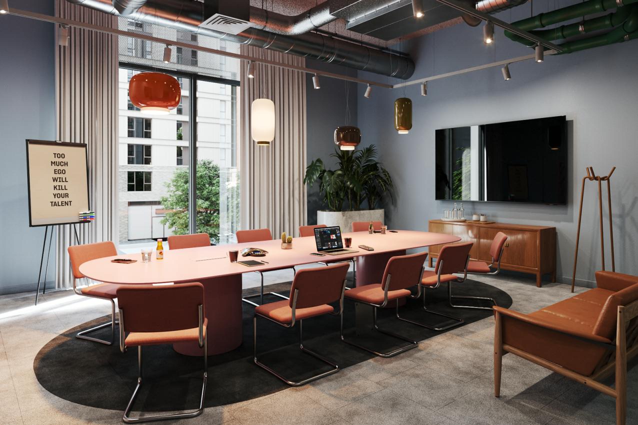 A boardroom with a long pink conference table, upholstered chairs, large window, and pendant lighting at The Social Hub.