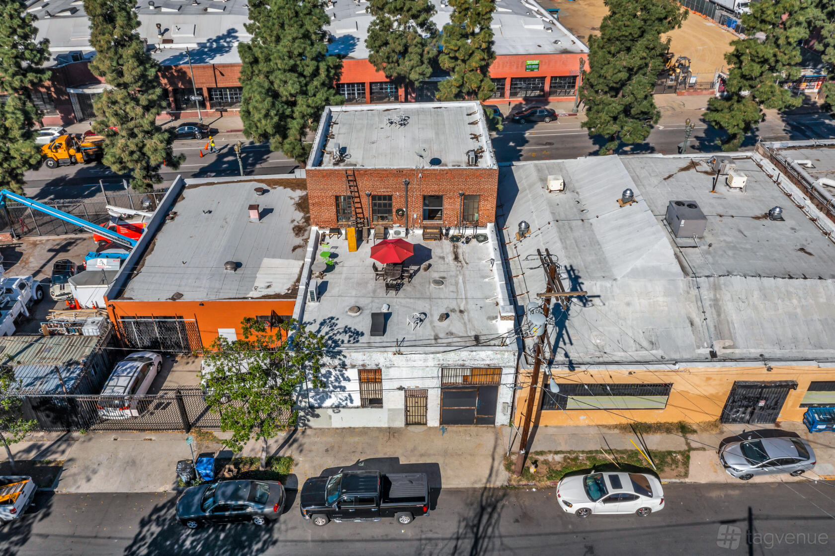 A recording studio with a rooftop patio featuring an umbrella and outdoor seating at Seahorse Sound Studios