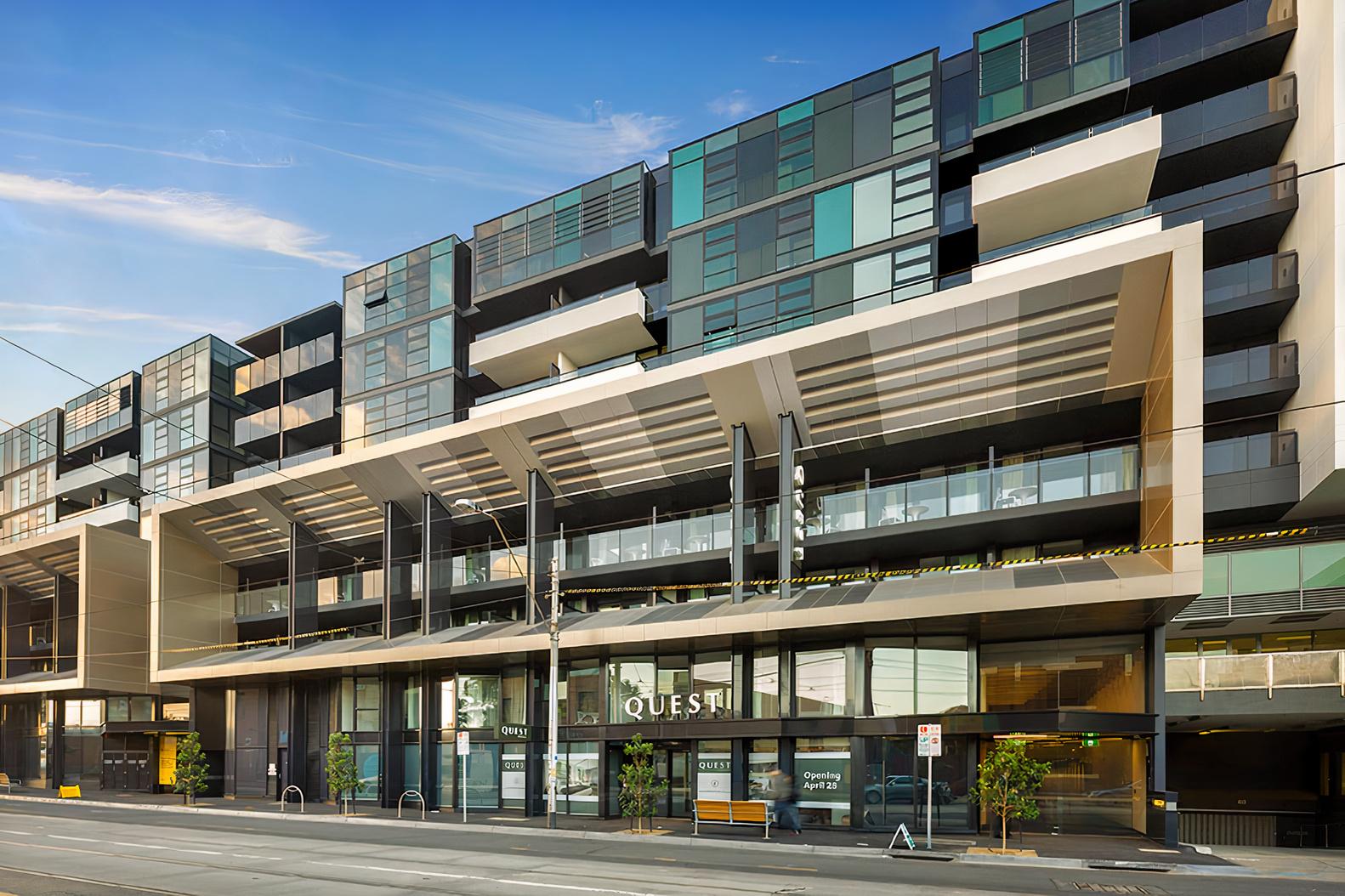 A modern hotel exterior with glass balconies and geometric façade at Corporate Living Accommodation Abbotsford.