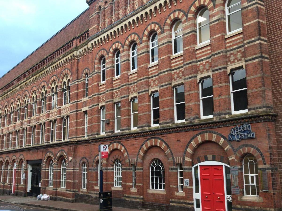 A film and photo studio in a historic brick building with arched windows at Sumei Studios.