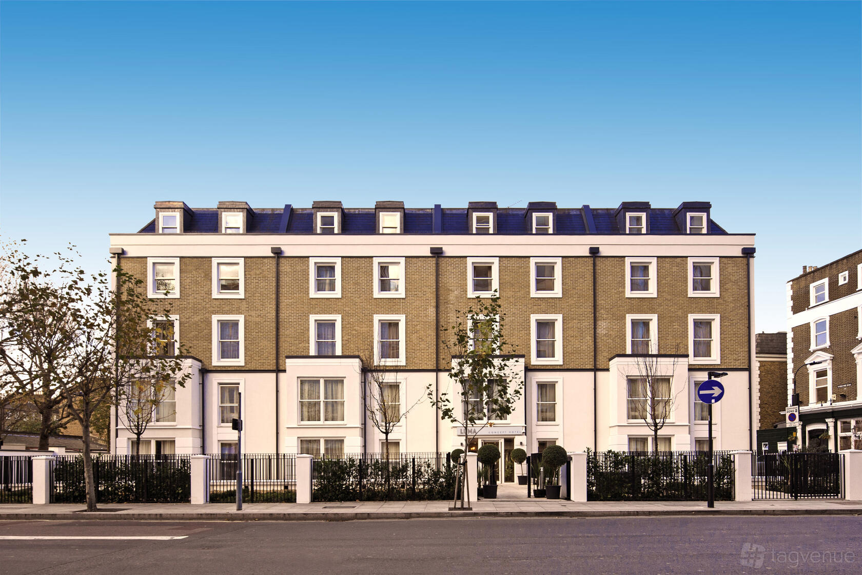 A hotel with a brick facade, white accents, and large windows at Heeton Concept Hotel - Luma Hammersmith.