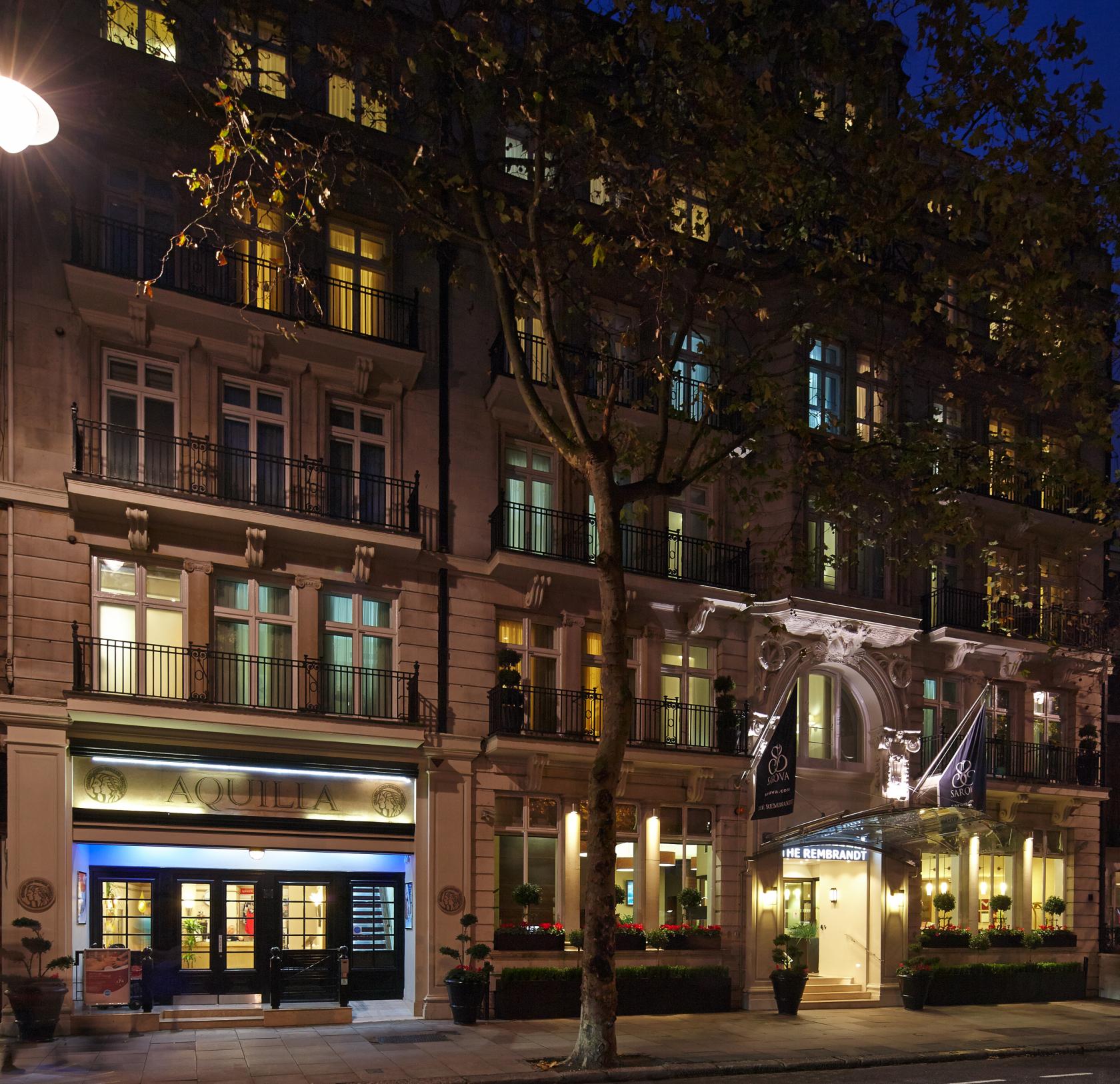 An event venue with a classic stone facade, tall windows, and balconies at Aquilla Health and Fitness.