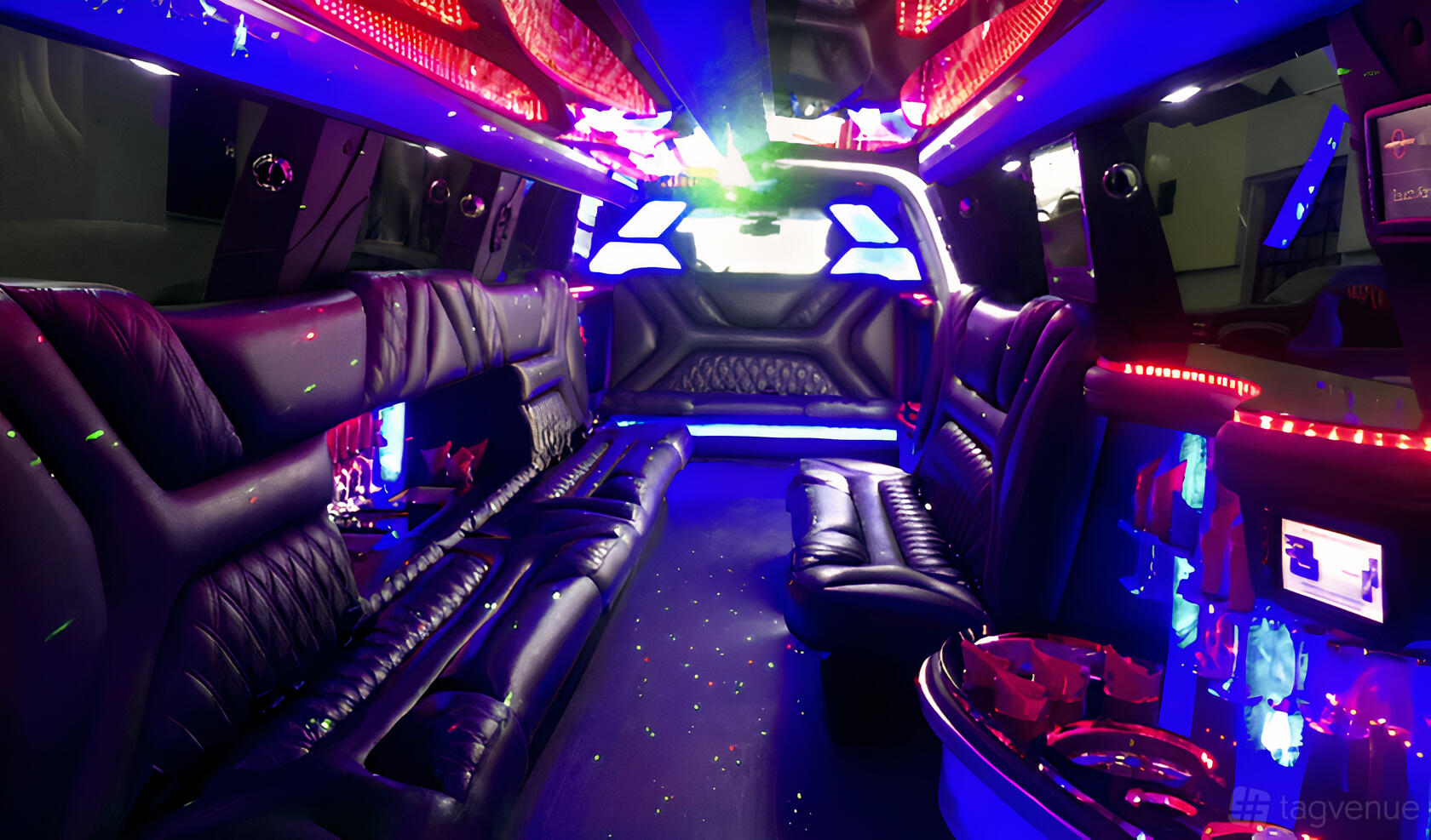 A party bus with black leather bench seating, color-changing LED lights, and built-in cup holders at NY City Limo Company Limo-house.