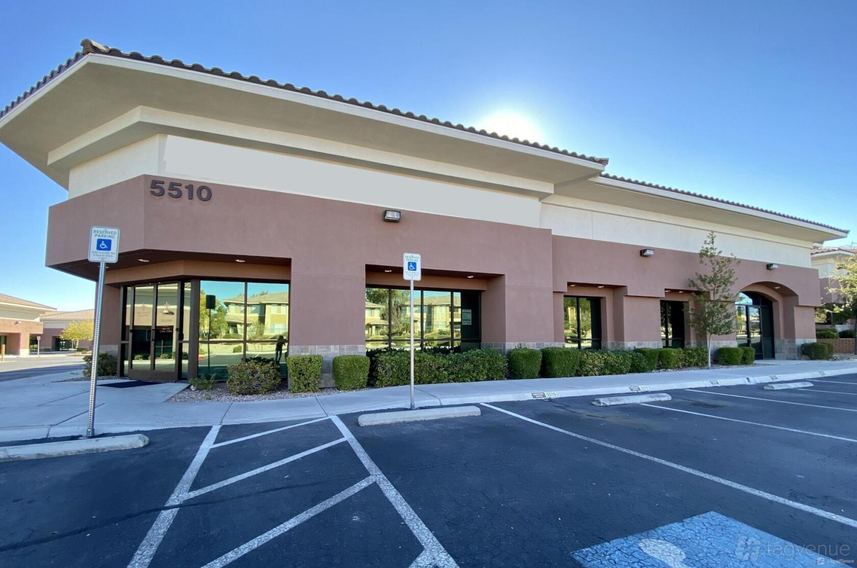 A meeting centre with large windows, tan stucco exterior, and accessible parking at OFFICENEST - SOUTHWEST.