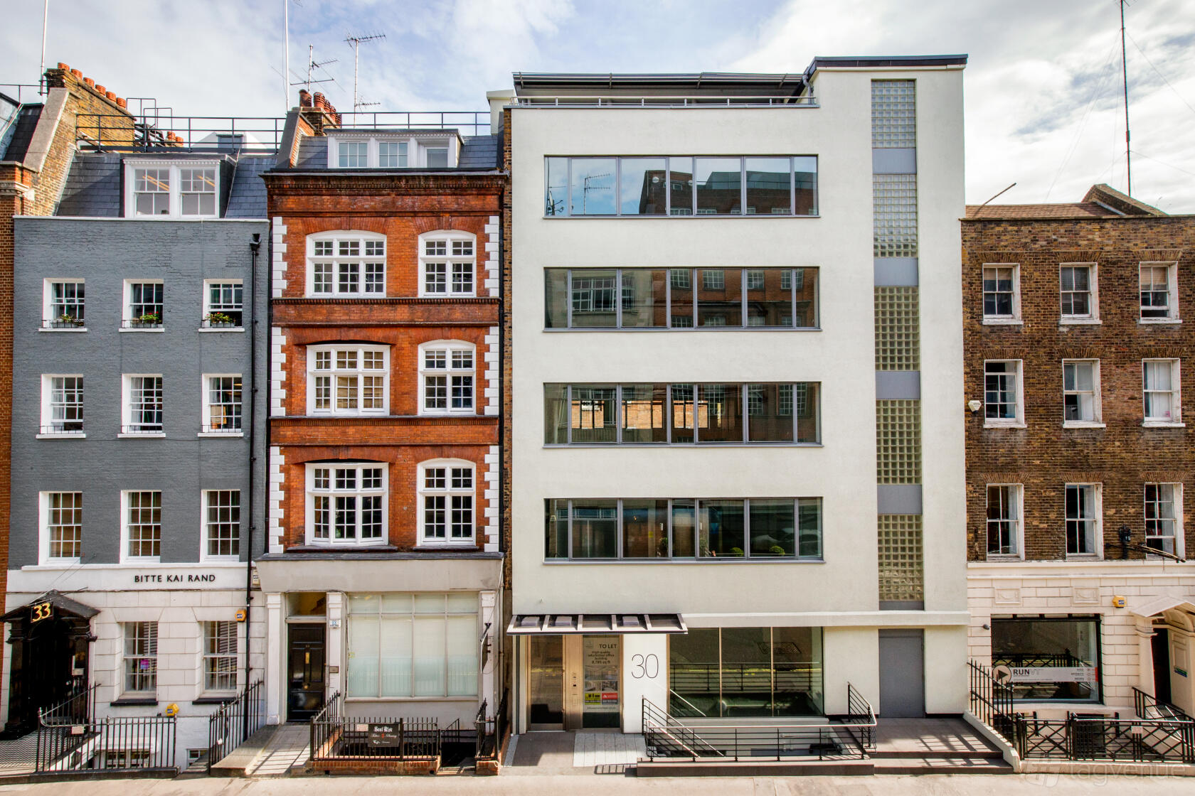 A meeting centre with a modern white exterior and large vertical windows at Landmark: Newman Street, Fitzrovia, London.