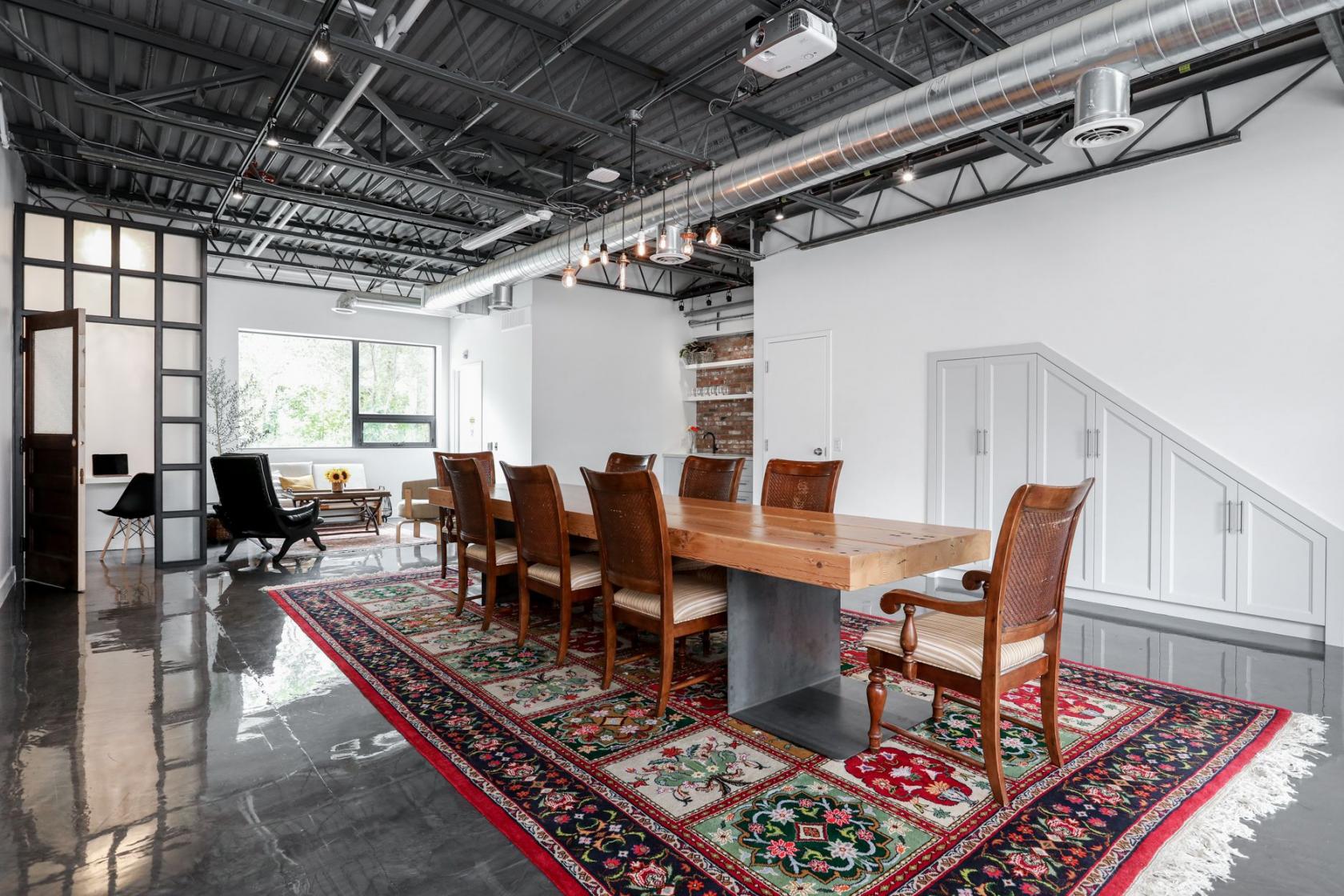 its center is a handcrafted grand table that is ideal for meetings