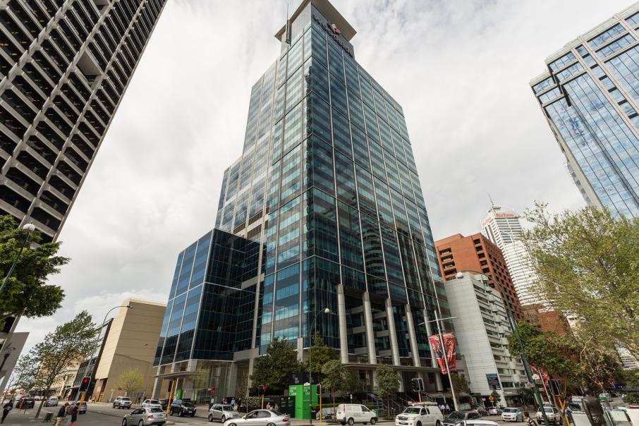 A meeting centre in a glass high-rise building with street-level trees and parked cars at Dexus Place St Georges Terrace.