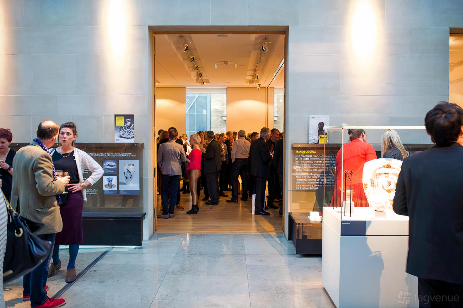 An event space with high ceilings, natural light, and glass display cases at The Goldsmiths' Centre Atrium.