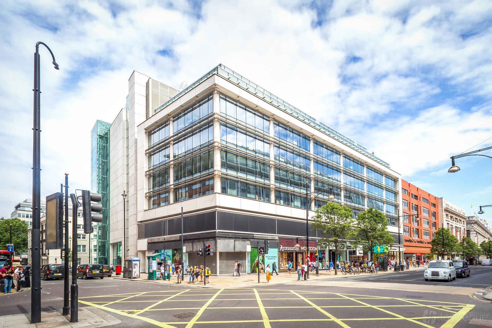 A meeting centre with a modern glass exterior on a busy city corner at Landmark: Oxford Street, London.