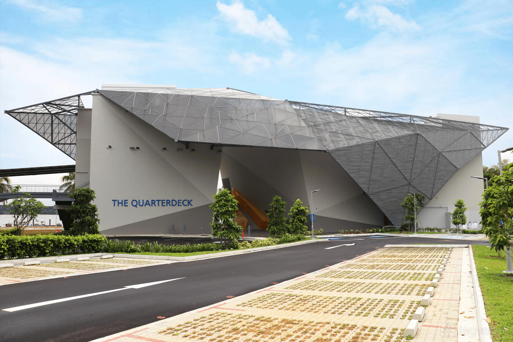 A versatile event space with geometric architecture and a landscaped entrance at SAF Yacht Club.