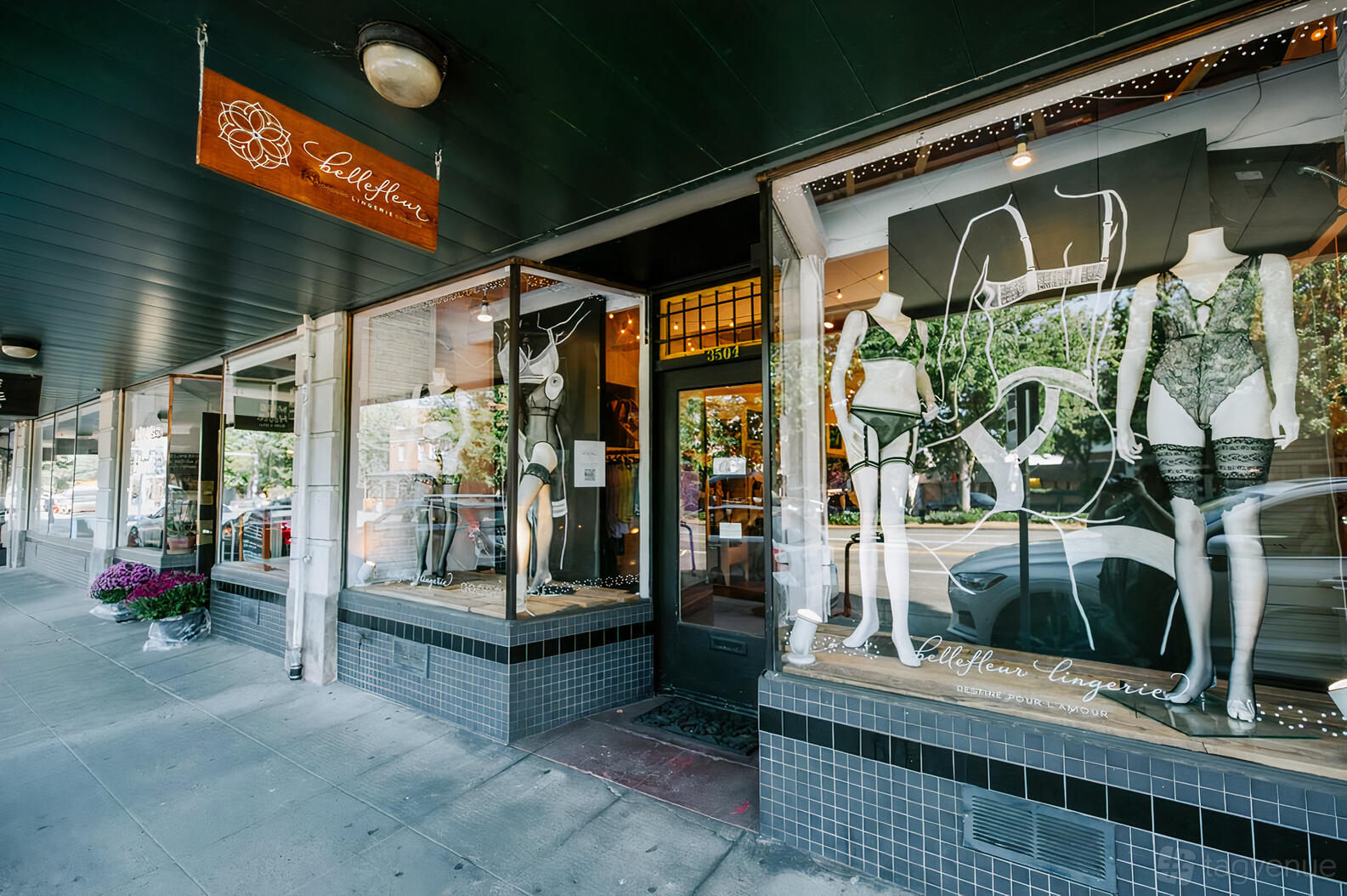 A versatile event space with large storefront windows, black tile trim, and lingerie displays at Bellefleur Lingerie Boutique.
