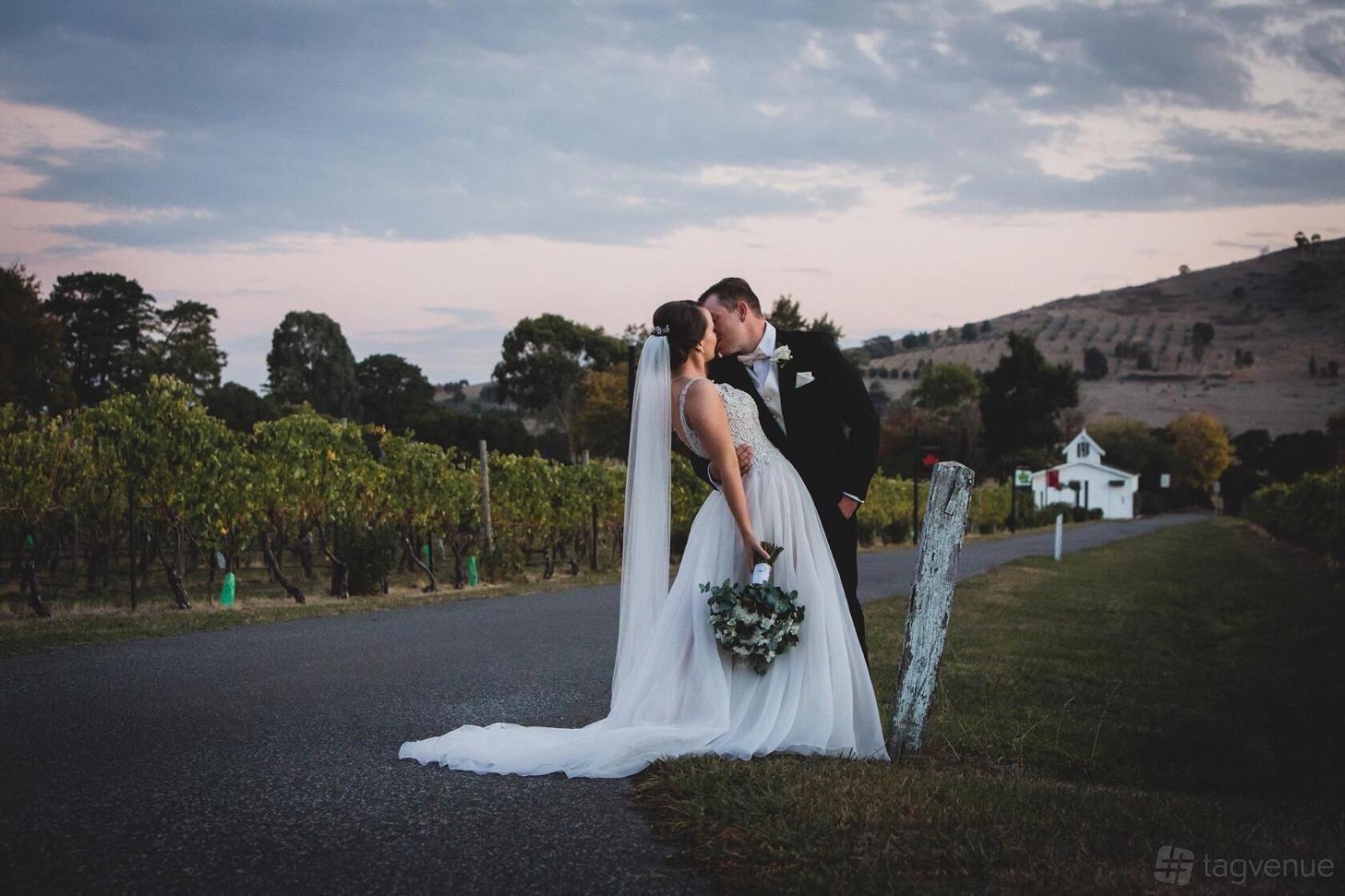 A restaurant with a vineyard backdrop and rolling hills at Fergusson Winery & Restaurant.