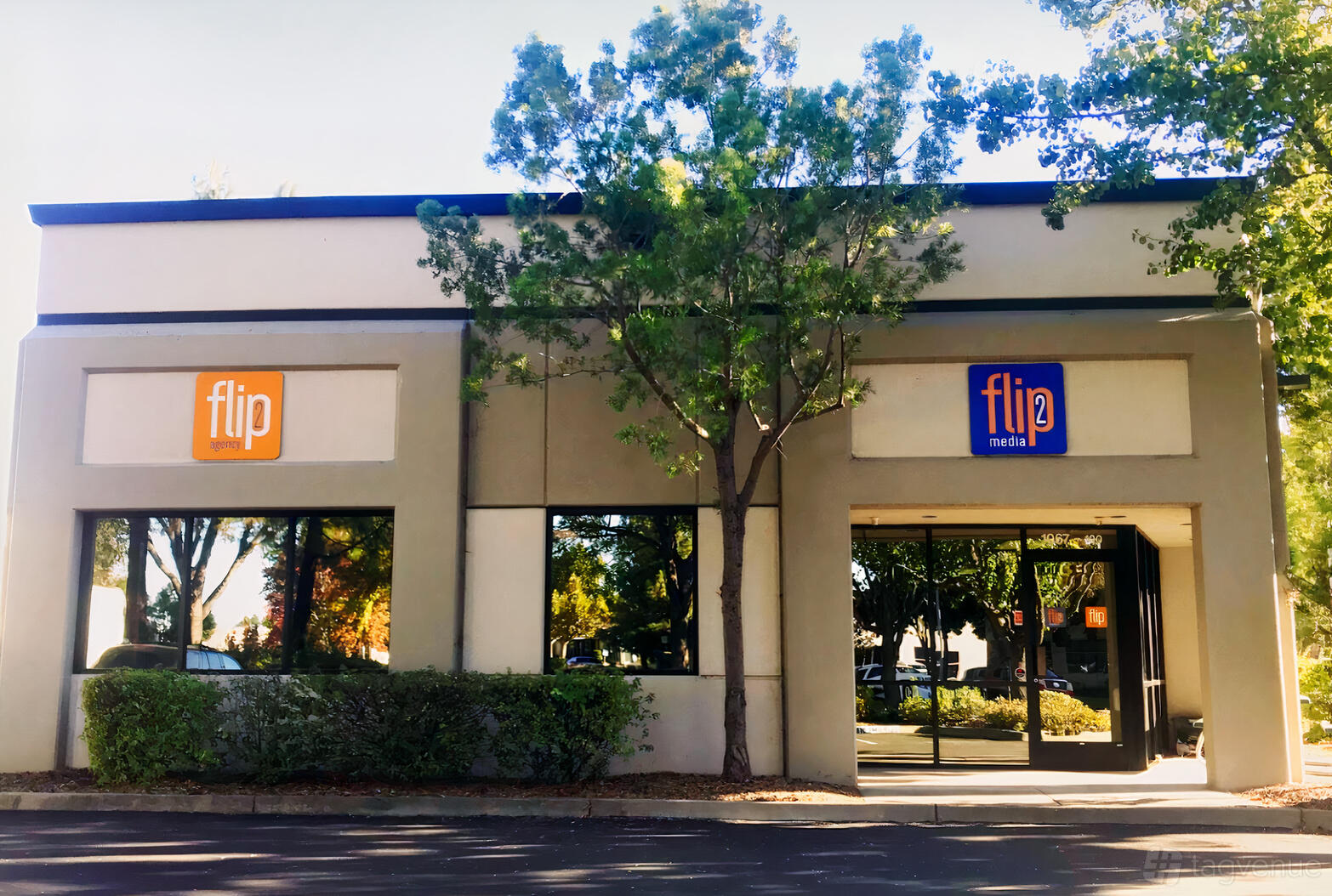 A film and photo studio with a modern facade, large windows, and visible signage at Flip2Media.