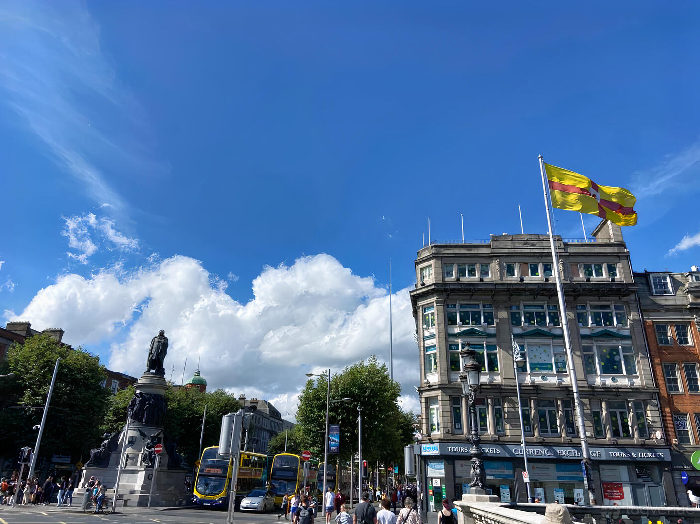 A meeting centre in a historic building with large windows and a flag flying outside at tcube.