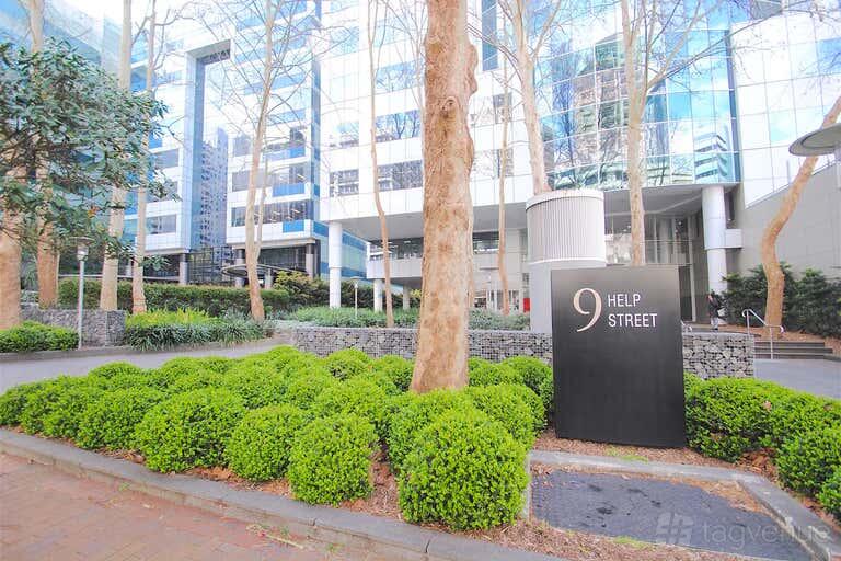 A meeting centre with glass building facade, manicured hedges, and a black address sign at cirque Chatswood.