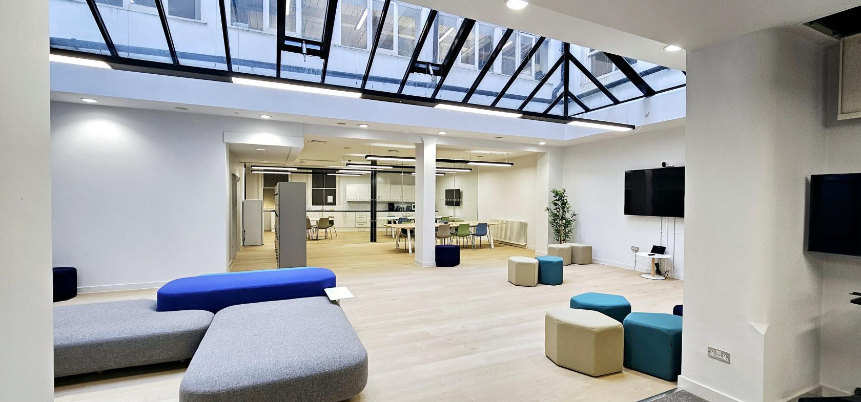 An event space with skylight ceiling, modular seating, and open lounge area at ZEBOX UK.