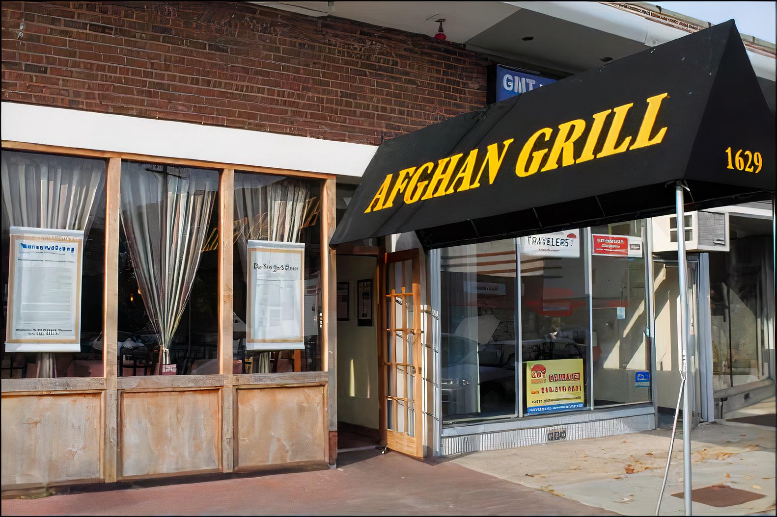 A restaurant entrance with a black canopy, large windows, and beige curtains at Afghan Grill.