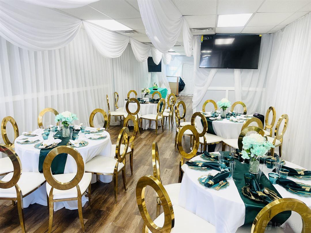 An event venue with round tables, gold chairs, turquoise accents, and white drapery at Sade's Event Place.