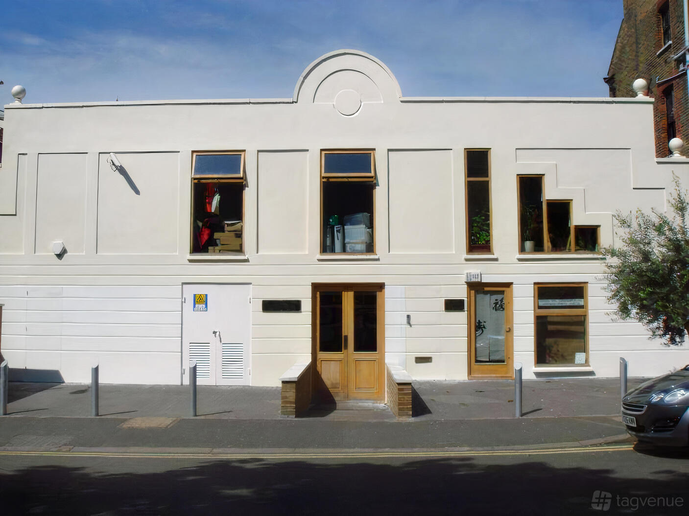 A meeting centre with geometric windows and a light-colored facade at Wellbeing Centre London.