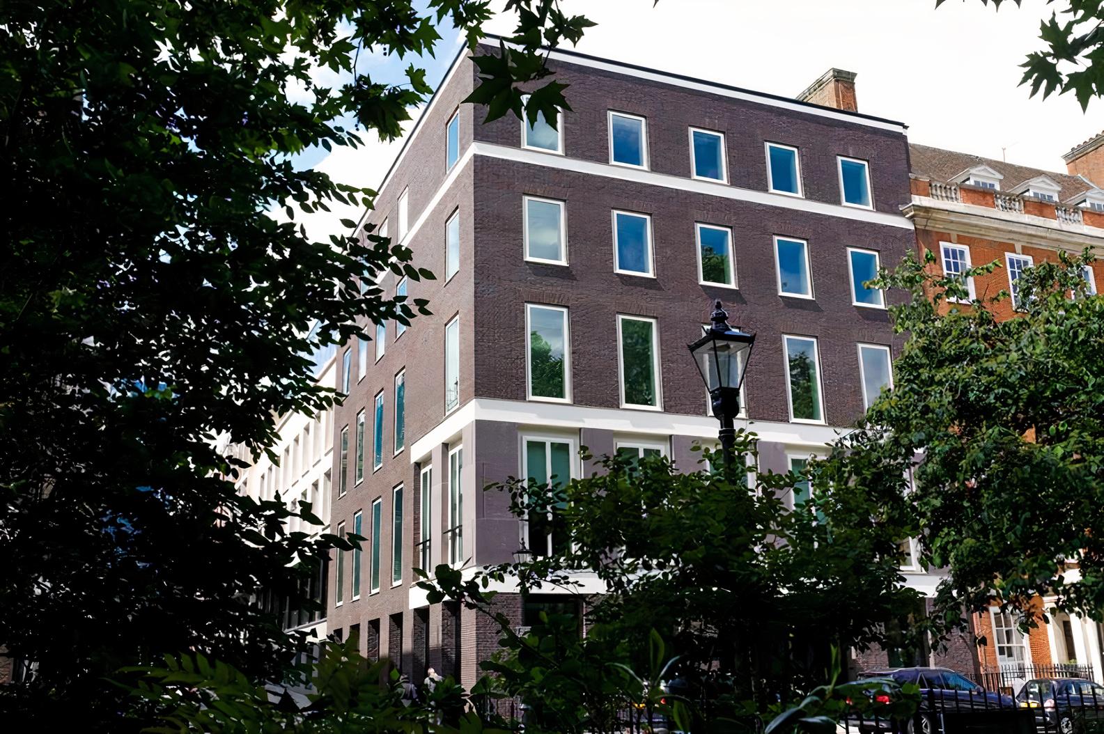 A modern meeting centre with large rectangular windows and a brick exterior at The Clubhouse 8 St. James's Square.