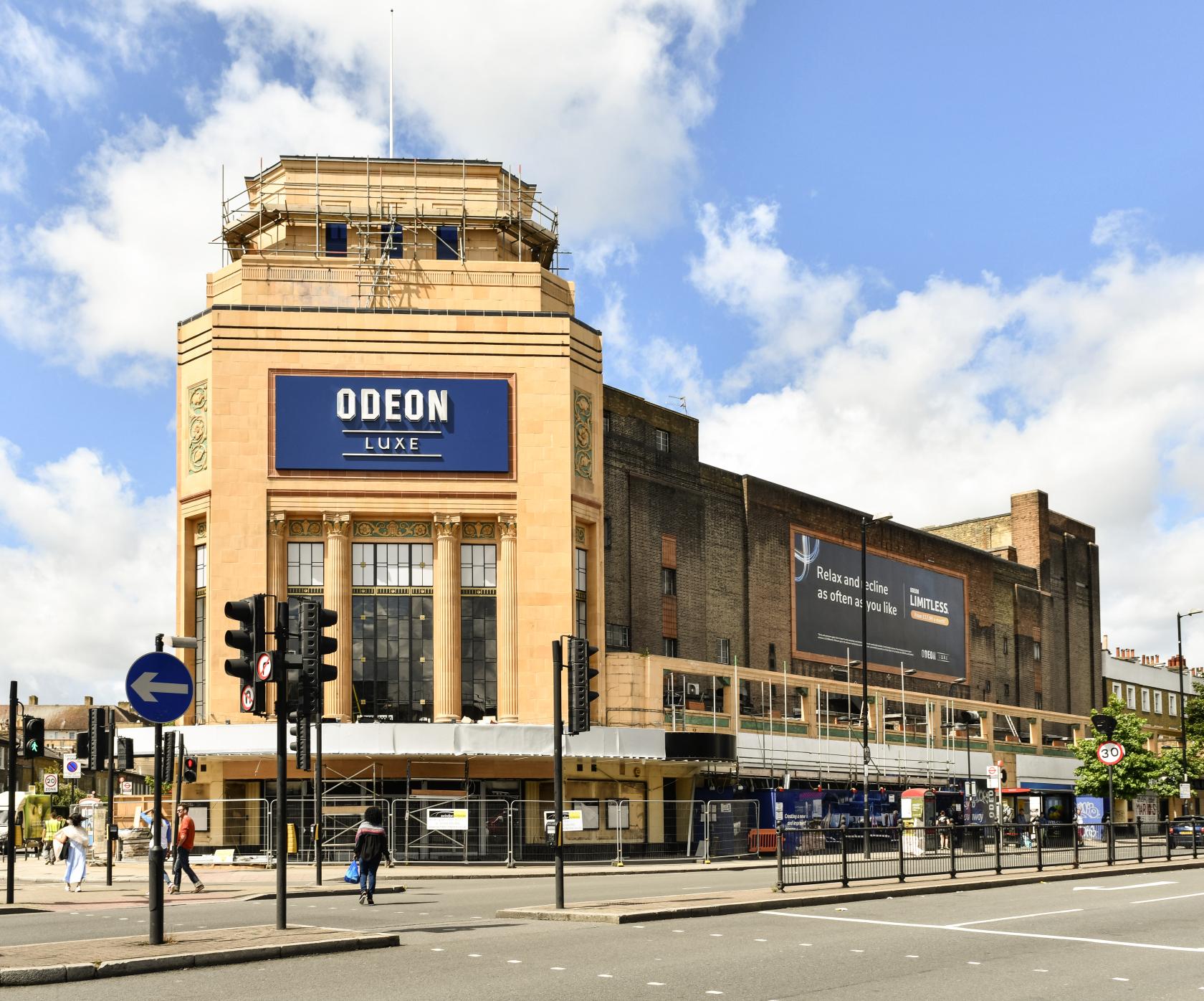 A historic cinema with art deco facade and large marquee sign at ODEON LUXE Holloway.