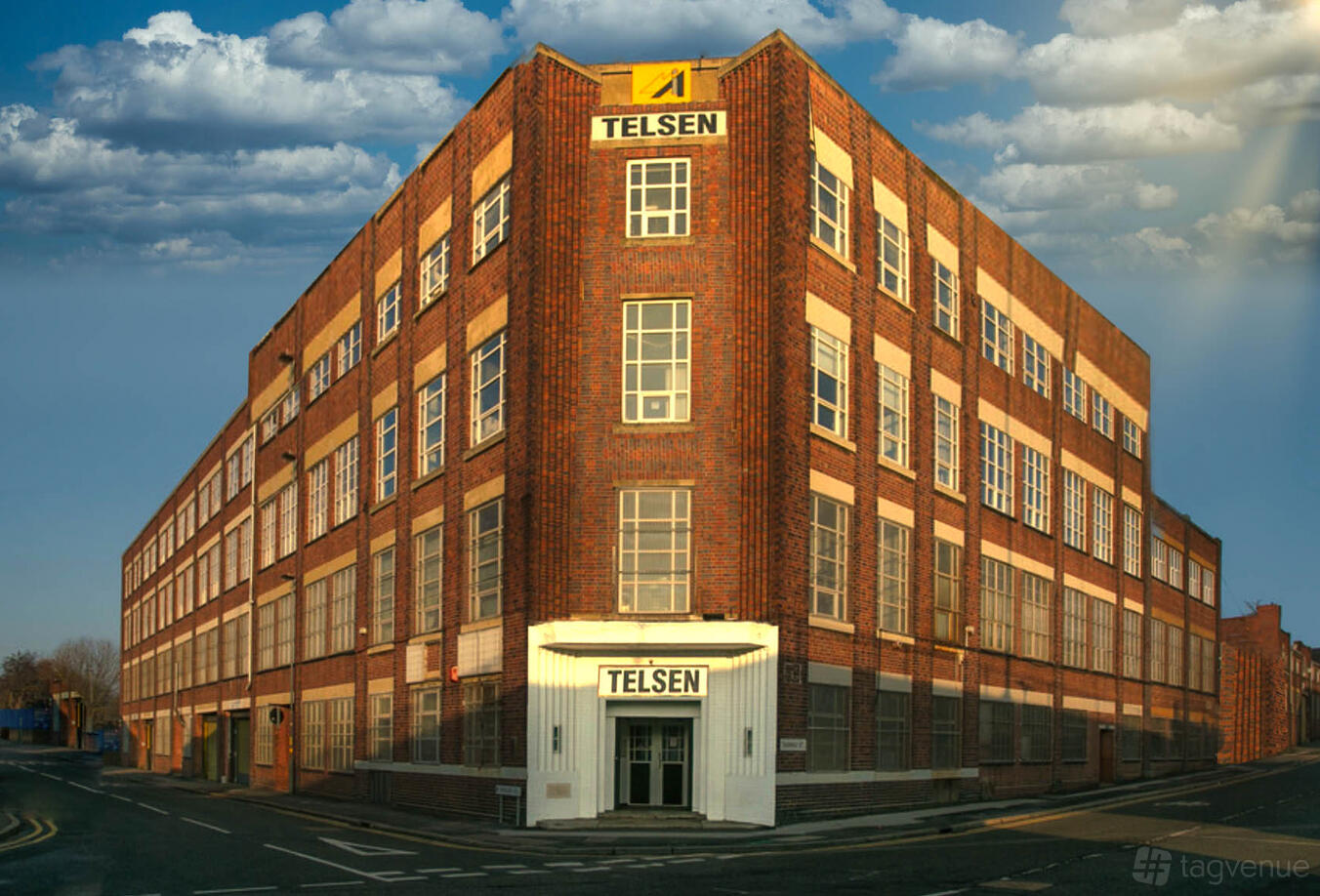 A large brick film and photo studio with multiple windows and art deco entrance at CFC Studio.